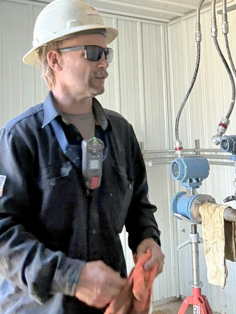Field worker wearing a Monitor Mate with his gas monitor in the breathing zone